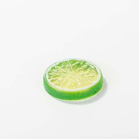 Artificial lemon slice with green peel