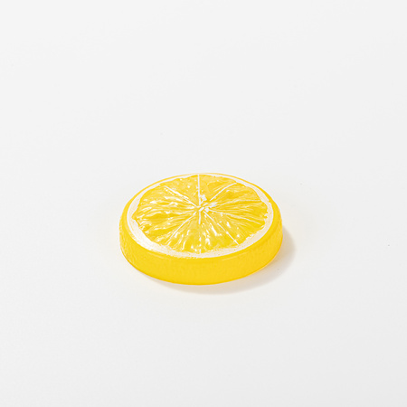 Artificial lemon slice with yellow peel